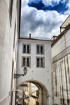 Old colorful houses and streets of Lisbon, Portugal in Spring. Majestic facades and old street lights.