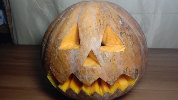 pumpkin face closeup with eye and mouth for halloween
