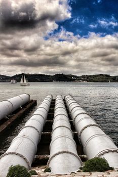 Drain pipes on the banks of The Tagus River in Lisbon, Portugal