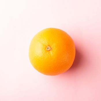 Top view of Fresh full orange fruit in the studio shot isolated on pink background, Healthy food concept
