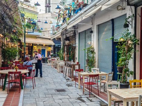 Less crowd eating & drinking at mostly empty tavernas in the center at Bezesteni area.