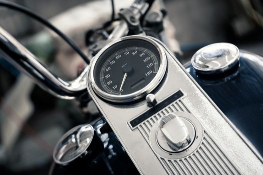 details of analog speedometer on vintage big bike, shallow depth of field