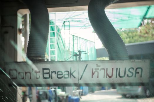 do not break warning sign on air blowers of automated car wash machine at car care service station