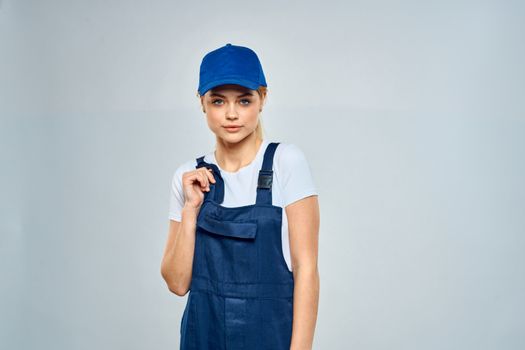 Woman in working uniform blue cap service lifestyle service. High quality photo