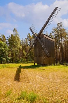 Old wooden windmill in rural area, Riga, Latvia