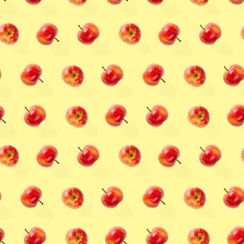 Seamless pattern with ripe apples. Apple seamless pattern on yellow background. Tropical fruit abstract background.