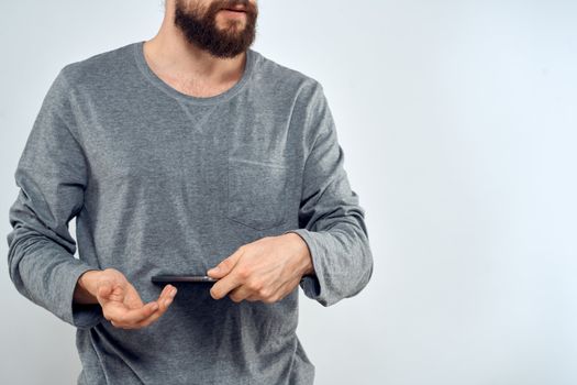 Man with tablet in hands technology internet lifestyle confident cropped view. High quality photo