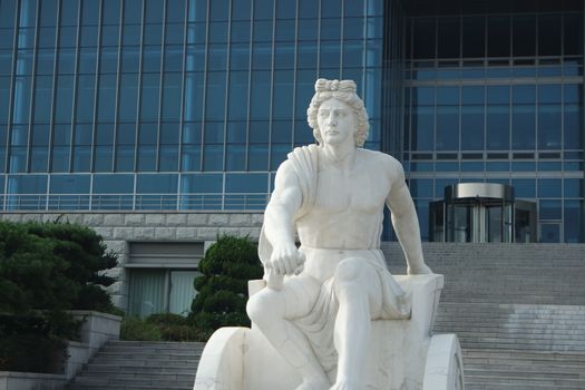 CHUNCHEON, SOUTH KOREA- October-03, 2020: White marble stone statue of sitting Poseidon or Neptune