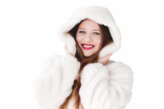 Young woman in fluffy fur coat with hood wrap, warm winter clothing for fashion and Christmas holidays design