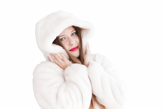 Young woman in fluffy fur coat with hood wrap, warm winter clothing for fashion and Christmas holidays design