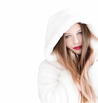 Young woman in fluffy fur coat with hood wrap, warm winter clothing for fashion and Christmas holidays design