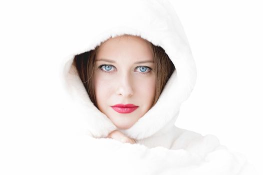 Young woman in fluffy fur coat with hood wrap, warm winter clothing for fashion and Christmas holidays design