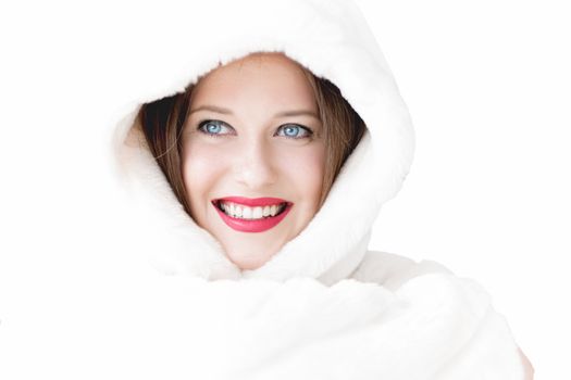 Young woman in fluffy fur coat with hood wrap, warm winter clothing for fashion and Christmas holidays design