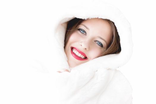 Young woman in fluffy fur coat with hood wrap, warm winter clothing for fashion and Christmas holidays design