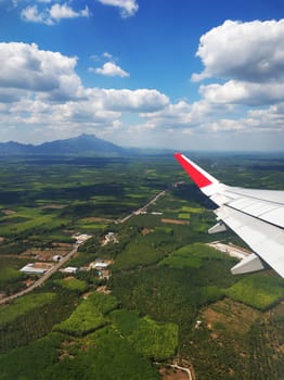 The view from the airplane window to the ground. Landscape view from the sky.