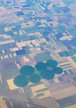 The view from the airplane window to the ground. Landscape view from the sky.