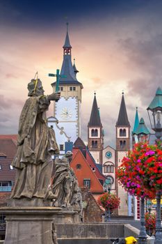 Old Main Bridge over the Main river and scenic towers in the Old Town of Wurzburg vertical view, Bavaria region of Germany