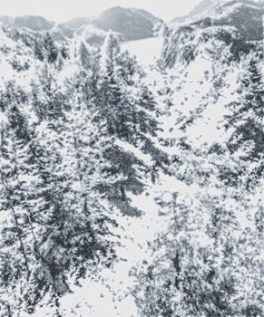 Christmas card with snowy mountains landscape in winter, monochrome photograph for art prints and printable designs