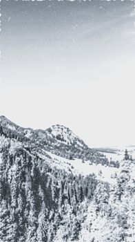 Christmas card with snowy mountains landscape in winter, monochrome photograph for art prints and printable designs