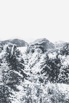 Christmas card with snowy mountains landscape in winter, monochrome photograph for art prints and printable designs