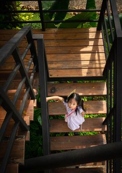 little girl walking down the stairs