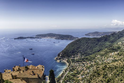 Scenic aerial view from the town of Èze over the beautiful coastline near the city of Nice, Cote d'Azur, France. It is one of the most renowned tourist site of the French Riviera