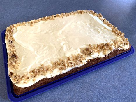 A blank cake for any happy celebration with a blue background