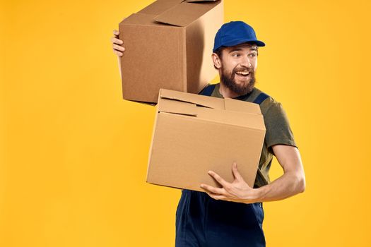 working man with box in hands delivery loading transportation service. High quality photo