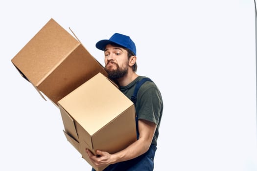 Working man with boxes in hands delivery service work lifestyle. High quality photo