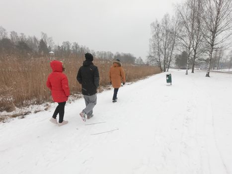 People have walked at a nature park during covid-19 pandemic social distancing isolation in Helsinki, Finland