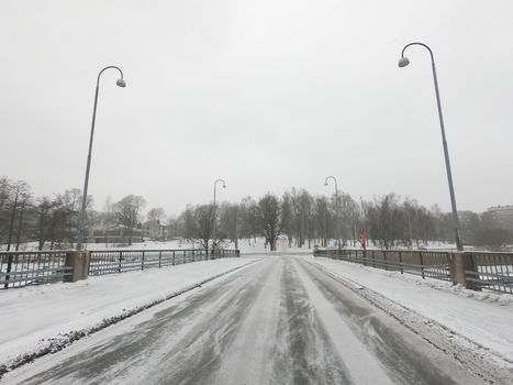 The road and nature park during covid-19 pandemic social distancing isolation in Helsinki, Finland