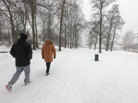 People have walked at a nature park during covid-19 pandemic social distancing isolation in Helsinki, Finland