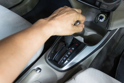 hand of man hold Gear R  Reverse the gear selected to drive the vehicle backward