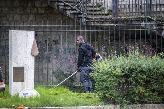 terni,italy actober 17 2020:black gardener who works for the municipality of terni