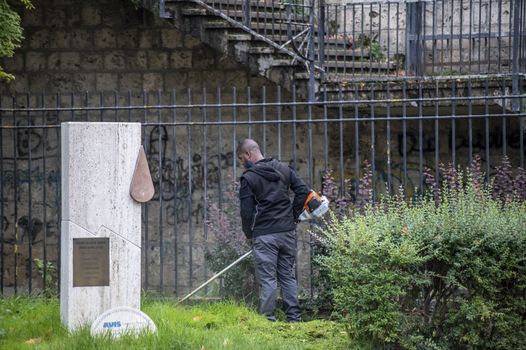 terni,italy actober 17 2020:black gardener who works for the municipality of terni