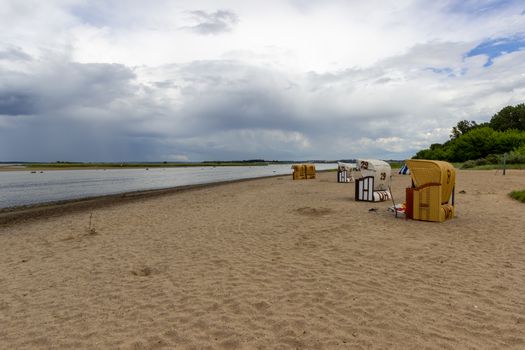 Scenic view at  beach on Poel island at the Baltic sea, Germany with beach chairs and say 