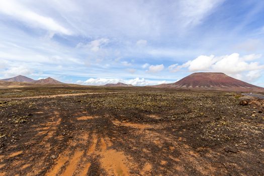 Scenic view at the volcanic landscape in the natural park of Corralejo (Parque Natural De Corralejo) on canary island Fuerteventura, Spain 