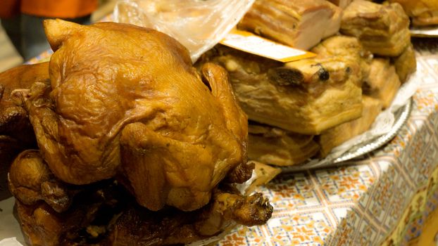 Fresh grilled chicken for sale at the farmers market counter