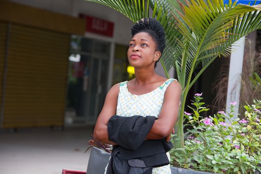 young businesswoman in trouble reflected outside during break