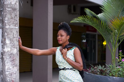 businesswoman thinking during the break in the street