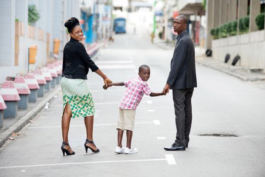 family walking together and having fun in the city. Happy family and vacation concept