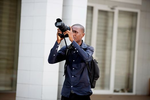 young tourist taking pictures in the city