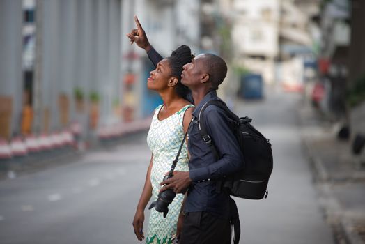 tourist couple walking in the city and observing cultural place to take a picture