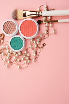 cosmetic accessories eyeshadow accessories makeup brushes merchandise collection professional cosmetics on pink background.