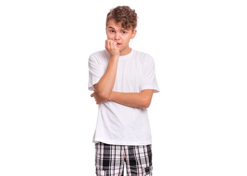Scared teenager biting fingernails, isolated on white background