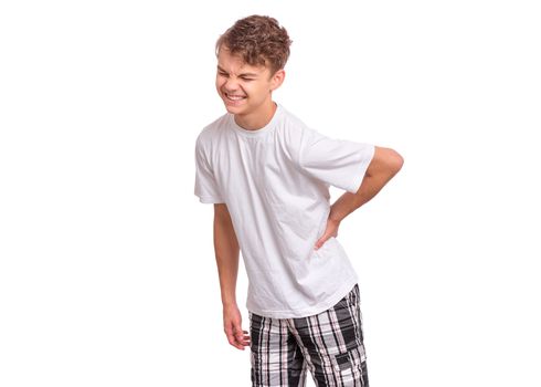 Portrait of unhappy teen boy suffering from backache, isolated on white background