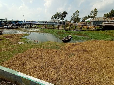 black colored wooden boat on lake