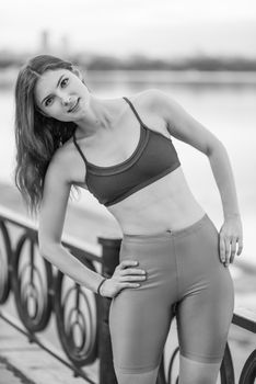 Brunette girl doing sports exercises in the morning