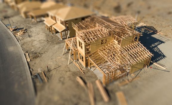 Aerial View of New Homes Construction Site with Tilt-Shift Blur.