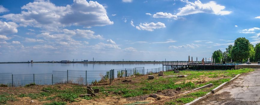 Vesele, Ukraine 07.24.2020. View of the Dnipro river and Kakhovskaya hydroelectric power station from the side of Chateau Trubetskoy in Kherson region, Ukraine, on a sunny summer day